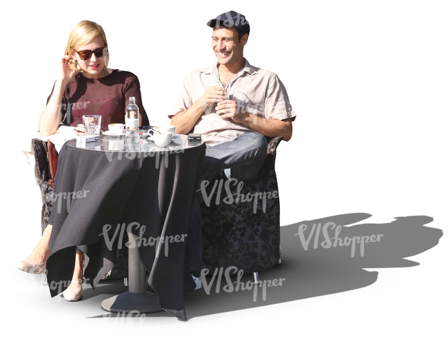 man and a woman sitting in a street cafe