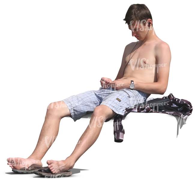 man without a shirt sitting and listening to music