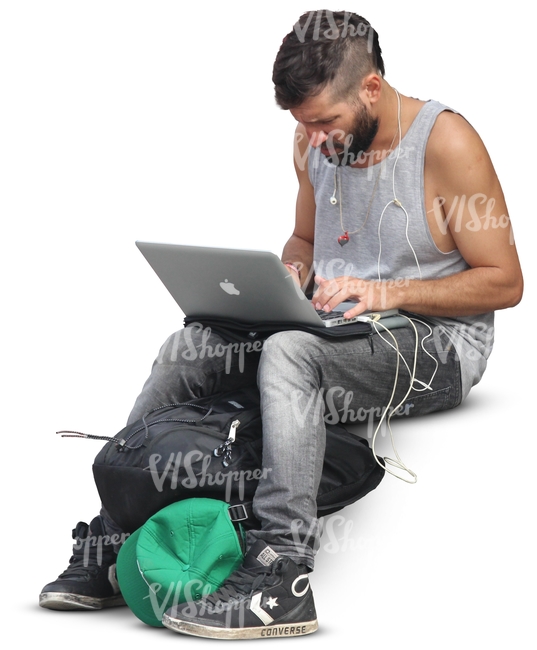 man sitting and working on his computer