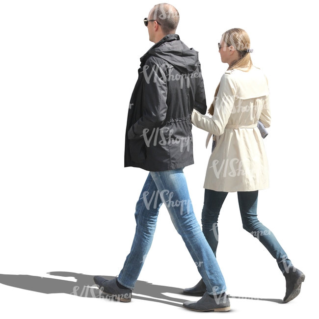 couple in spring coats walking arm in arm