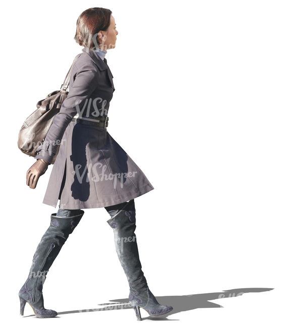 woman in a grey spring coat walking