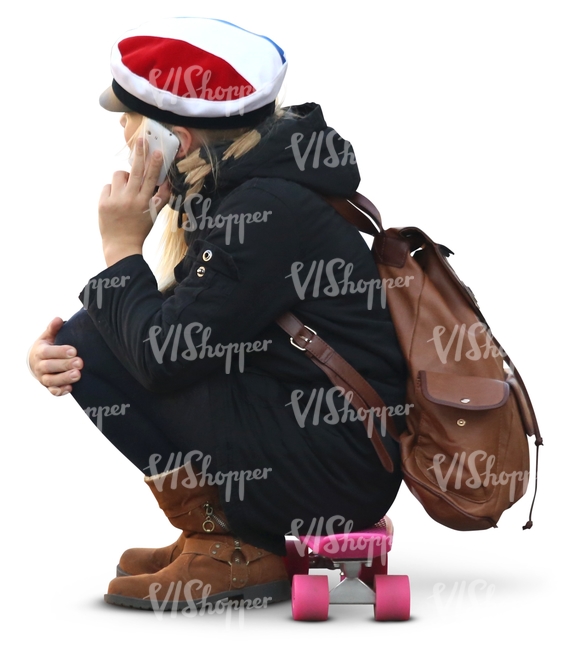 schoolgirl sitting on a skateboard