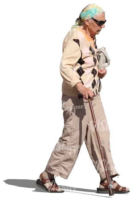elderly woman with sunglasses walking with a stick
