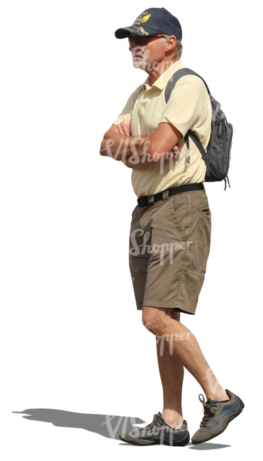 elderly man with a backpack walking