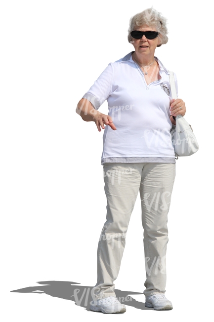 elderly woman in a white outfit standing