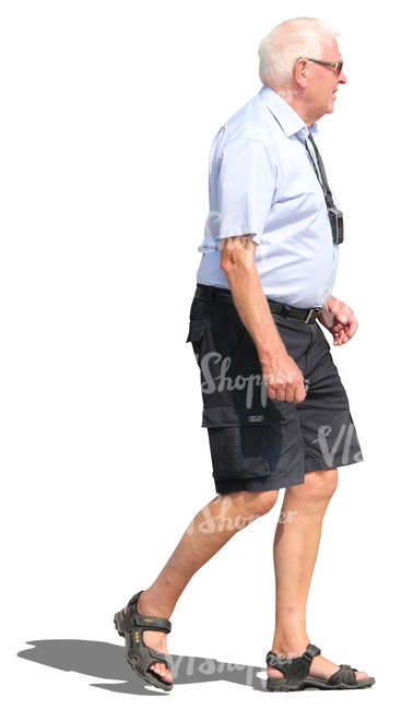 elderly man in shorts walking