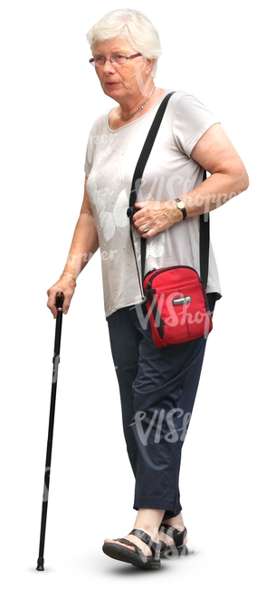 elderly woman walking with a walking stick