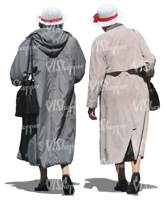 two elderly women wearing coats walking