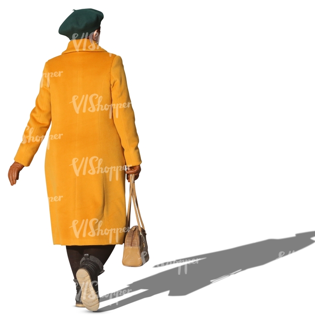 elderly woman in a yellow coat walking