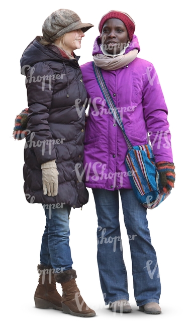 two women in winter clothes standing and talking