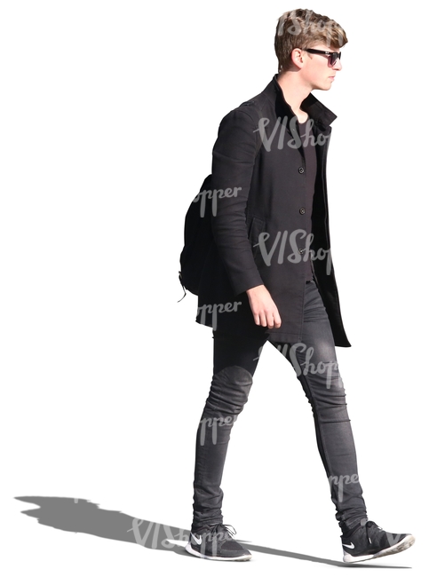 young man in black walking