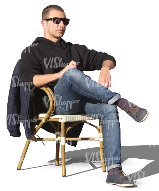 man sitting in a street cafe