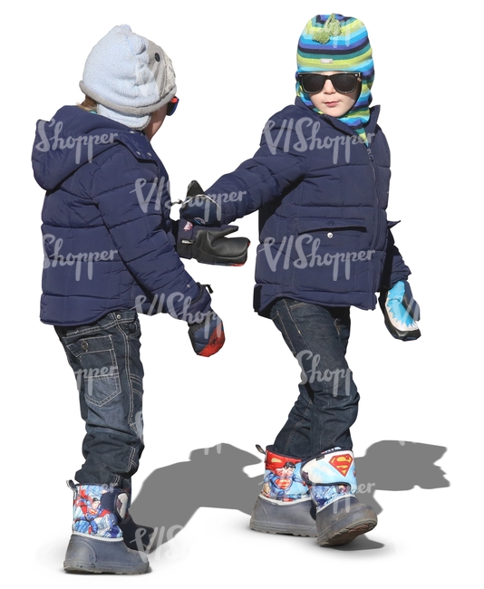 two kids in winter clothes walking