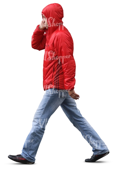 man in a red raincoat walking in the rain 