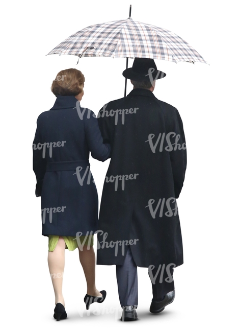 elderly couple walking in the rain under un umbrella