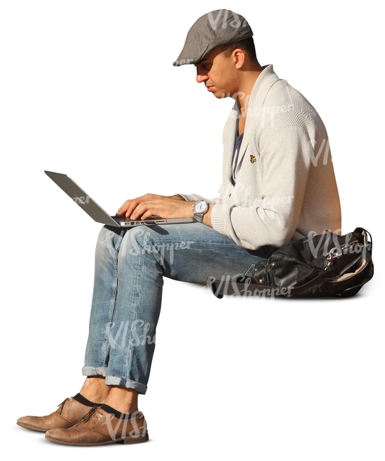 man sitting and working on his laptop