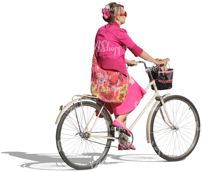 woman dressed in pink riding a bike