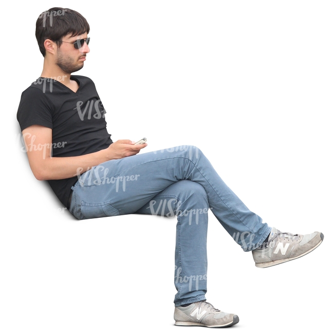man sitting with a phone in his hand