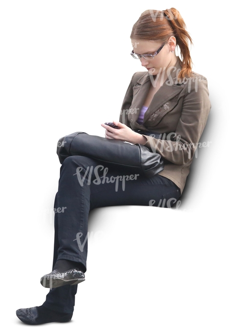 woman sitting and looking at her phone