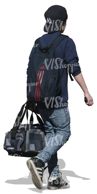 young boy walking and carrying a sports bag