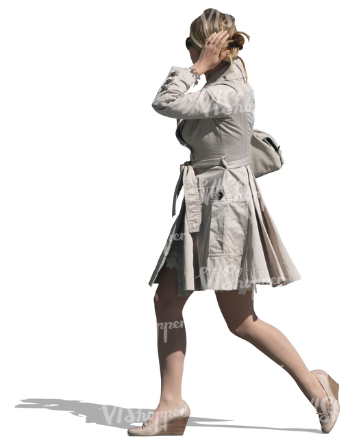 woman in a white coat walking