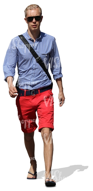 cut out young man in red shorts walking