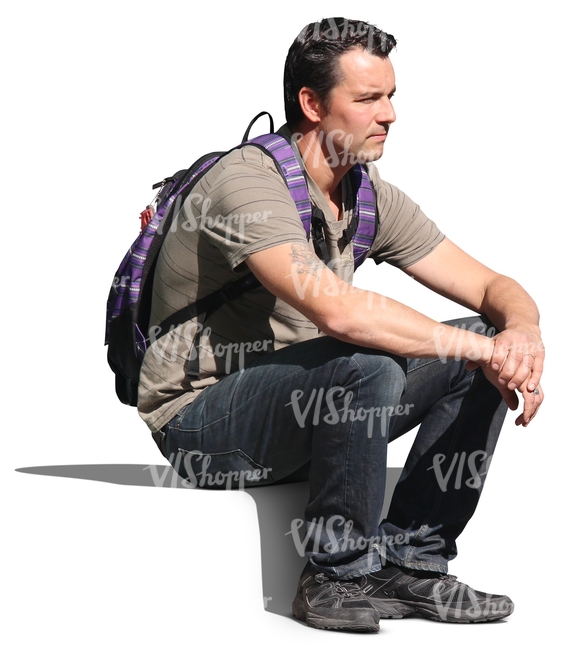 man with a backpack sitting