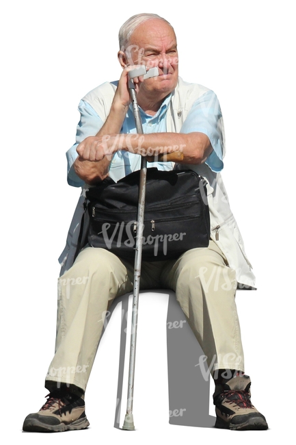 older man with a crutch sitting
