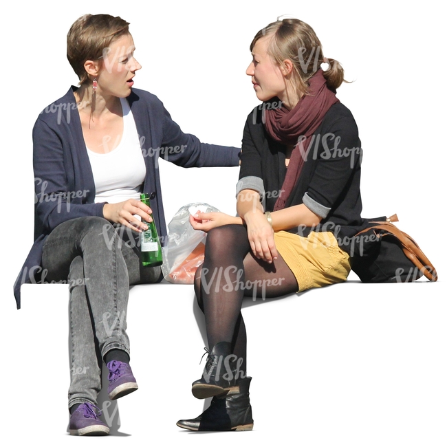 two women sitting and talking