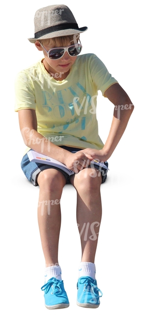 boy with a stylish hat sitting and reading