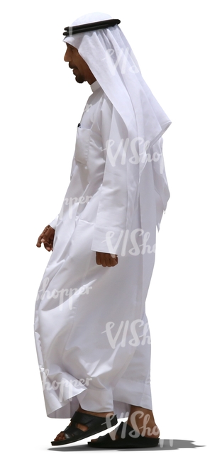 arab man in a white dishdasha walking