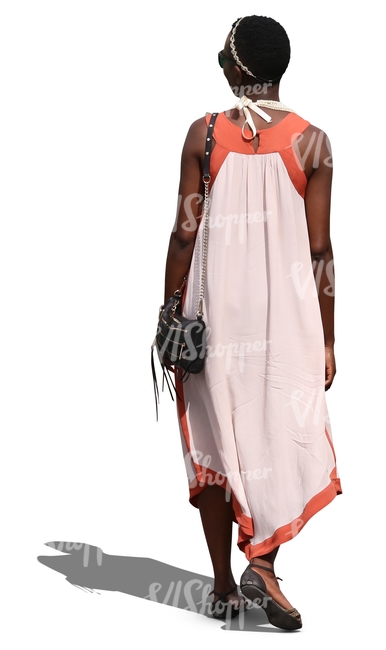 african woman in a summer dress walking