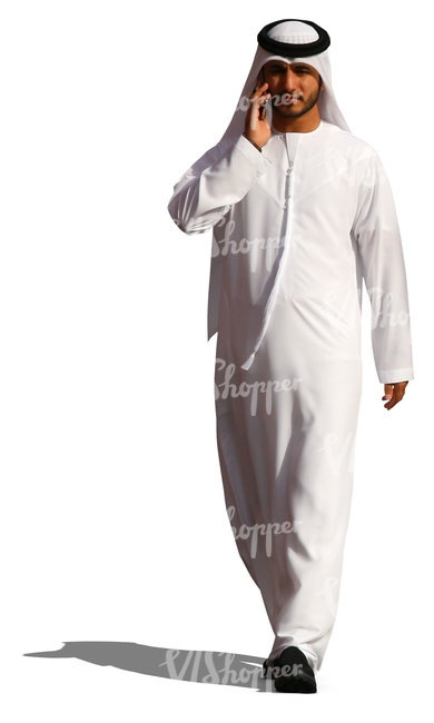 arab man walking and talking on the phone