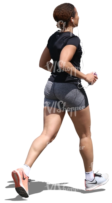 black woman jogging and listening to music