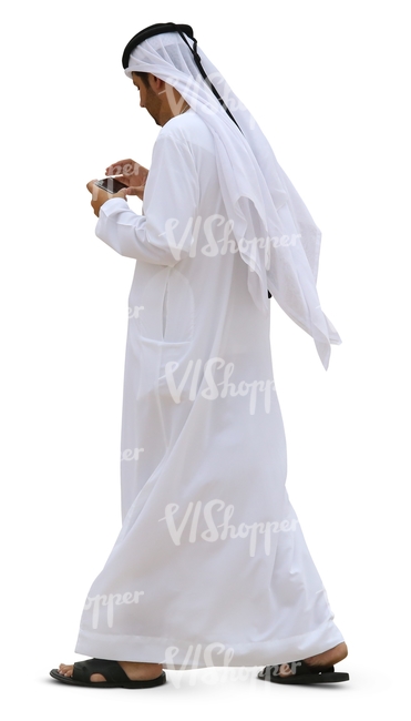 arab man walking and looking at his phone