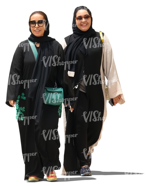 two muslim women walking and smiling