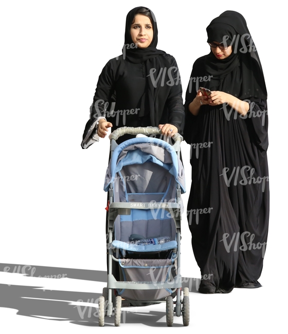 two arab women pushing a baby stroller