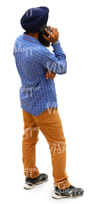 hindu man standing and talking on the phone
