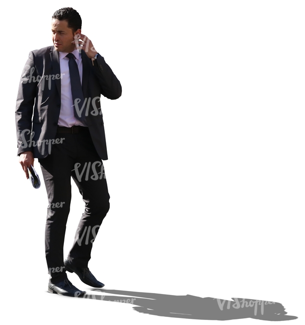 cut out backlit businessman walking