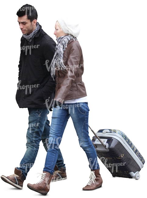 man and woman walking and pulling a suitcase