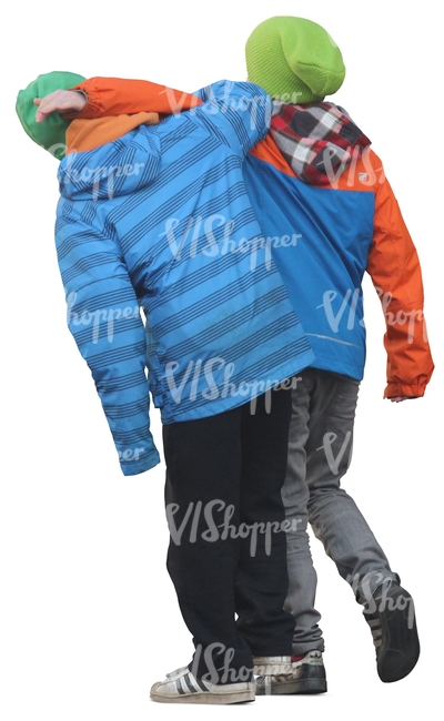 two boys in winter jackets walking playfully