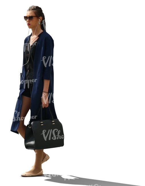 cut out backlit woman walking and listening to music