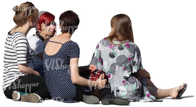 group of women sitting on the ground