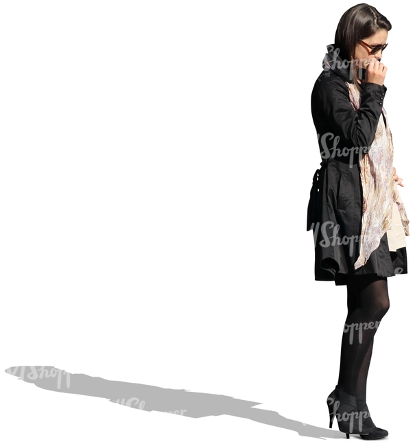 businesswoman in a black coat standing and thinking