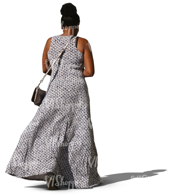 black woman in a long dress walking