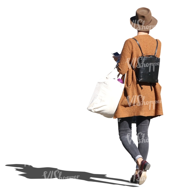 cut out woman in a stylish brown coat walking