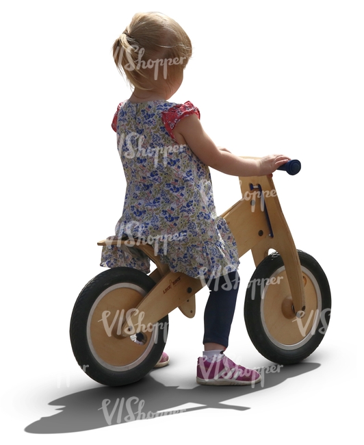 young girl riding a likeabike