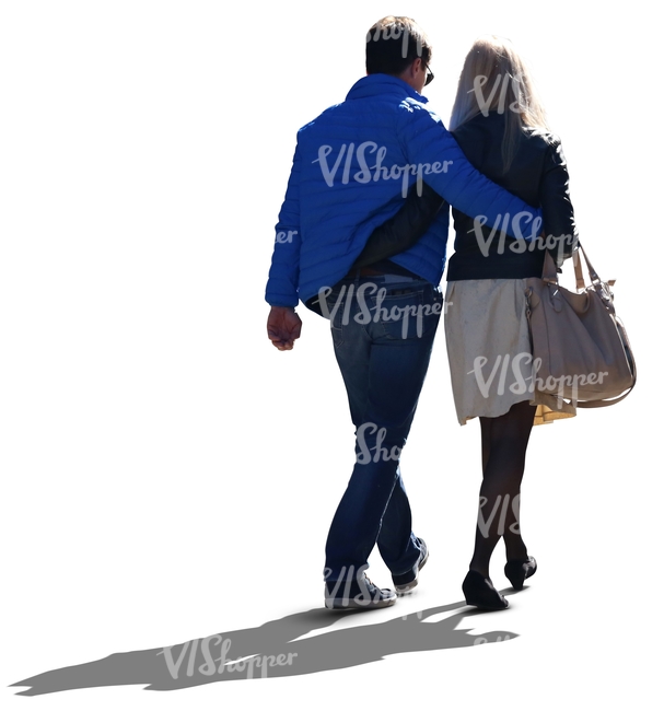 backlit couple walking arms around each other