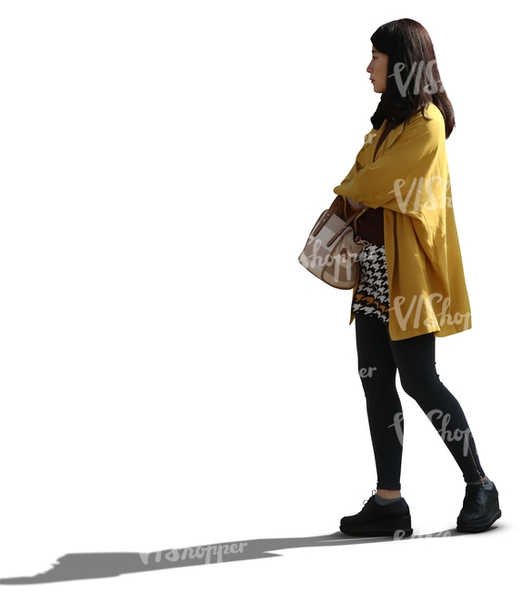 backlit asian woman standing