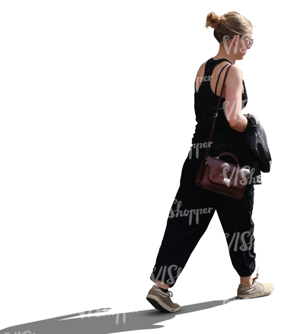 backlit woman walking in summertime